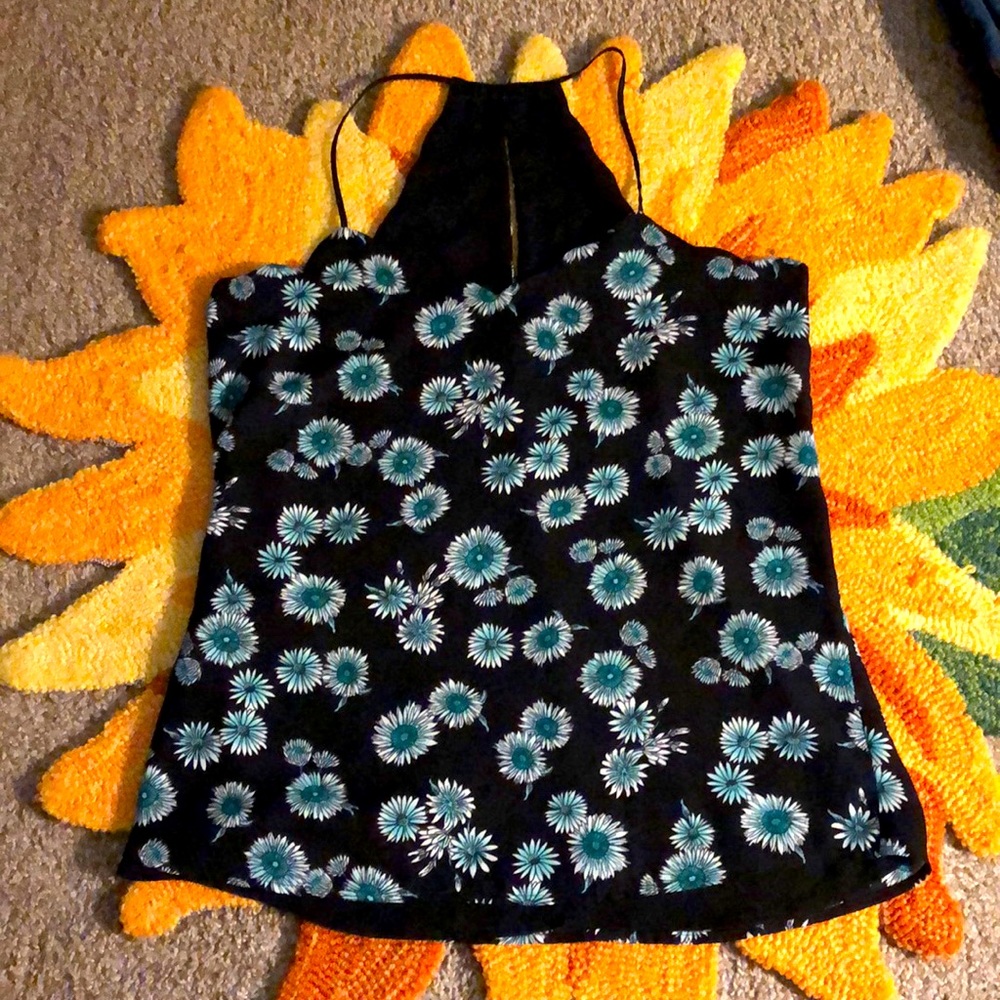 Blue floral design on black background tank top.
